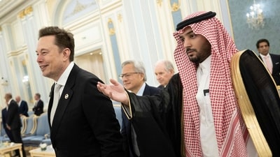 Senior Advisor to the US President Elon Musk (L) and Nvidia CEO Jensen Huang (C) are directed to greet the Saudi Crown Prince at the Royal Court in Riyadh on May 13, 2025. (Photo by Brendan Smialowski / AFP) (AFP) Senior Advisor to the US President Elon Musk (L) and Nvidia CEO Jensen Huang (C) are directed to greet the Saudi Crown Prince at the Royal Court in Riyadh on May 13, 2025. (Photo by Brendan Smialowski / AFP) (AFP)