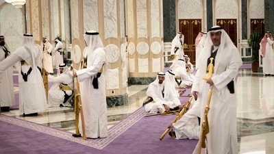Saudi men with swords wait during a meeting between US President Donald Trump and Saudi Arabia's Crown Prince Mohammed Bin Salman at the Royal Court in Riyadh on May 13, 2025. Trump enjoyed a lavish, royal welcome in Saudi Arabia on the first state visit of his second term, with the US president foremost focused on business deals at the start of a Gulf tour. (Photo by Brendan Smialowski / AFP) (AFP) Saudi men with swords wait during a meeting between US President Donald Trump and Saudi Arabia's Crown Prince Mohammed Bin Salman at the Royal Court in Riyadh on May 13, 2025. Trump enjoyed a lavish, royal welcome in Saudi Arabia on the first state visit of his second term, with the US president foremost focused on business deals at the start of a Gulf tour. (Photo by Brendan Smialowski / AFP) (AFP)