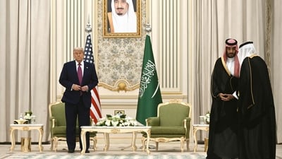 Saudi Crown Prince Mohammed bin Salman (C) speaks with an advisor ahead of meeting with US President Donald Trump during a bilateral meeting in Riyadh on May 13, 2025. Trump enjoyed a lavish, royal welcome in Saudi Arabia on the first state visit of his second term, with the US president foremost focused on business deals at the start of a Gulf tour. (Photo by Brendan SMIALOWSKI / AFP) (AFP) Saudi Crown Prince Mohammed bin Salman (C) speaks with an advisor ahead of meeting with US President Donald Trump during a bilateral meeting in Riyadh on May 13, 2025. Trump enjoyed a lavish, royal welcome in Saudi Arabia on the first state visit of his second term, with the US president foremost focused on business deals at the start of a Gulf tour. (Photo by Brendan SMIALOWSKI / AFP) (AFP)