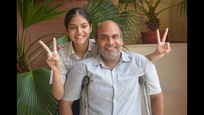Srishti Sharma celebrating her success with her father, Rajiv Sharma. (Sant Arora/HT) Srishti Sharma celebrating her success with her father, Rajiv Sharma. (Sant Arora/HT)