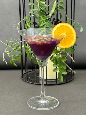 The blue pea tea cocktail with mango and ice apple chunks The blue pea tea cocktail with mango and ice apple chunks