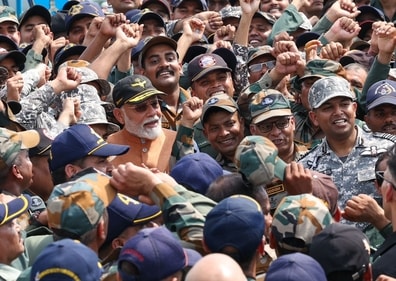 Prime Minister Narendra Modi with IAF personnel at Punjab's Adampur air base on Tuesday. (HT Photo) Prime Minister Narendra Modi with IAF personnel at Punjab's Adampur air base on Tuesday. (HT Photo)