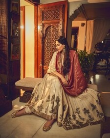 Actor Sonam A Kapoor wears a red-and-white Gulab Ghaghra from Ateev Anand. Made with recycled cotton, it features an intricate gold border and pitta work along the hem Actor Sonam A Kapoor wears a red-and-white Gulab Ghaghra from Ateev Anand. Made with recycled cotton, it features an intricate gold border and pitta work along the hem