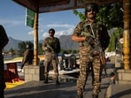 Indian security force personnel stand guard on the banks of Dal Lake following a terrorist attack near south Kashmir's Pahalgam in Srinagar (REUTERS)
