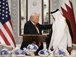 Qatar's Emir Sheikh Tamim bin Hamad al-Thani shakes the hand of the US President Donald Trump (L) at the start of a state dinner at the Lusail Palace in Doha on May 14, 2025. Qatar's Emir Sheikh Tamim bin Hamad al-Thani shakes the hand of the US President Donald Trump (L) at the start of a state dinner at the Lusail Palace in Doha on May 14, 2025.