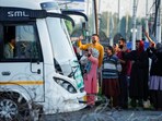Relatives of Kashmiri hajj pilgrims wave goodbye as they depart for the annual pilgrimage, in Srinagar on Wednesday. (REUTERS)