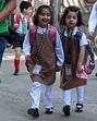 Students walk to attend classes in Srinagar on Tuesday. (AFP)