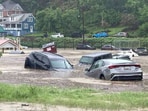 In this photo provided by Alley and Tim Wade, cars can be seen in floodwaters in Westernport, Maryland on Tuesday, May 13, 2025. (Alley and Tim Wade via AP)