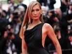 Bella Hadid arrives at Cannes Film Festival in a black Saint Laurent look. 