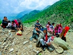 People wait after authorities in J&K asked residents of border villages not to rush back to homes until the areas are sanitized and cleared of any unexplored shells in Baramulla. People wait after authorities in J&K asked residents of border villages not to rush back to homes until the areas are sanitized and cleared of any unexplored shells in Baramulla.