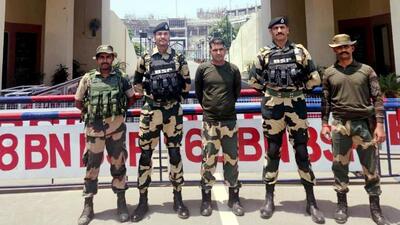 Border Security Force constable Purnam Kumar Shaw (centre), who was handed over to the BSF by Pakistan Rangers at the Attari-Wagah integrated checkpost near Amritsar on Wednesday morning. (HT Photo) Border Security Force constable Purnam Kumar Shaw (centre), who was handed over to the BSF by Pakistan Rangers at the Attari-Wagah integrated checkpost near Amritsar on Wednesday morning. (HT Photo)