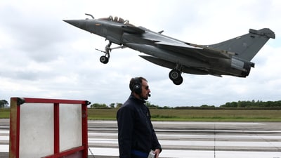 A French fighter aircraft Rafale M, manufactured by Dassault Aviation, takes part in a practice session for a simulated landing on an aircraft carrier at the Landivisiau Navy Air Base (in Saint-Servais, Brittany, France, (REUTERS File)