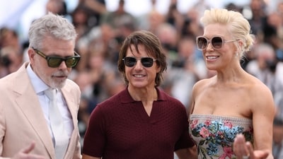 Christopher Mcquarrie (L), Tom Cruise and Hannah Waddingham share a laugh as they pose during a photocall for the film Mission: Impossible - The Final Reckoning. (Photo by Sameer AL-DOUMY / AFP) (AFP) Christopher Mcquarrie (L), Tom Cruise and Hannah Waddingham share a laugh as they pose during a photocall for the film Mission: Impossible - The Final Reckoning. (Photo by Sameer AL-DOUMY / AFP) (AFP)