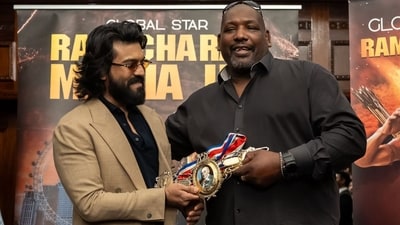 Julius Francis showed off one of his championship belts to Ram Charan. Julius Francis showed off one of his championship belts to Ram Charan.