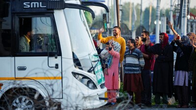 Relatives of Kashmiri hajj pilgrims wave goodbye as they depart for the annual pilgrimage, in Srinagar on Wednesday. (REUTERS) Relatives of Kashmiri hajj pilgrims wave goodbye as they depart for the annual pilgrimage, in Srinagar on Wednesday. (REUTERS)