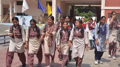 Students are all smiles as they arrive to attend school in Amritsar on Wednesday. The district administration said schools would remain open from 10.30am to 2.30pm. (Sameer Sehgal/HT)