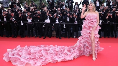 Even as Cannes barred extravagant dresses for this year's edition, model Heidi Klum arrived for the Opening Ceremony on May 13, 2025 in a pink dress with a long tail. (Photo by Sameer Al-Doumy / AFP) (AFP) Even as Cannes barred extravagant dresses for this year's edition, model Heidi Klum arrived for the Opening Ceremony on May 13, 2025 in a pink dress with a long tail. (Photo by Sameer Al-Doumy / AFP) (AFP)
