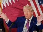 President Donald Trump gestures during a business roundtable in Doha. 