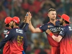 Royal Challengers Bengaluru's Josh Hazlewood, second left, celebrates with RCB teammates Royal Challengers Bengaluru's Josh Hazlewood, second left, celebrates with RCB teammates
