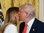 US President Donald Trump kisses US First Lady Melania Trump. (Photo by Jim WATSON / AFP) US President Donald Trump kisses US First Lady Melania Trump. (Photo by Jim WATSON / AFP)