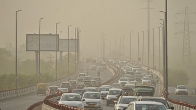New Delhi, May 15 (ANI): Vehicles move through a dust-laden road in New Delhi, on Thursday. (ANI Photo) (Vipin Kumar)