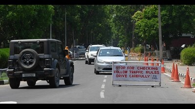 Despite the placement of barricades and stationing of security guards at the entrances and exits of the roads besides the Administration Block and in front of the arts departments, many vehicles were seen flouting the one-way traffic system and moving on the wrong side on the Panjab University campus in Chandigarh on Thursday. (Keshav Singh/HT)