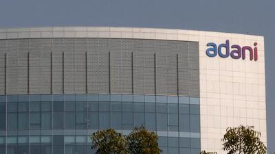 FILE PHOTO: The logo of the Adani Group is seen on the facade of its building (REUTERS)
