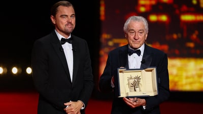 Robert De Niro receives an Honorary Palme d'Or Award from Leonardo DiCaprio at the 78th Cannes Film Festival in Cannes, (REUTERS)
