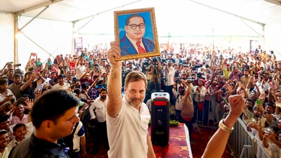 Congress MP and Lok Sabha Leader of Opposition Rahul Gandhi holds a portrait of Dr BR Ambedkar during the Shiksha Nyay Samvad programme, in Darbhanga, Thursday, May 15, 2025. (PTI)