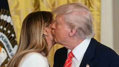 US President Donald Trump kisses US First Lady Melania Trump. (Photo by Jim WATSON / AFP) (AFP) US President Donald Trump kisses US First Lady Melania Trump. (Photo by Jim WATSON / AFP) (AFP)