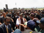 Defence Minister Rajnath Singh interacts with air force personnel as he departs from Srinagar International Airport.