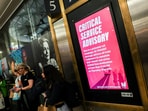 A screen displays a rail service disruption warning ahead of an NJ Transit strike deadline, at Penn Station in New York, U.S., May 15, 2025. REUTERS/Jeenah Moon