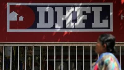 A woman walks past a DHFL signboard outside its office on the outskirts of Mumbai. (Reuters File Photo) A woman walks past a DHFL signboard outside its office on the outskirts of Mumbai. (Reuters File Photo)