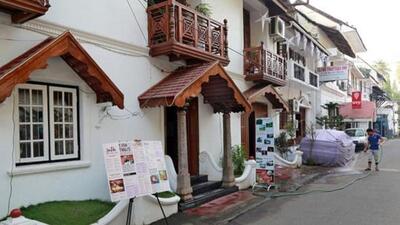 A worker cleans the entrance of a hotel at Fort Kochi, one of the major tourist destinations in Kerala. (Reuters File Photo) A worker cleans the entrance of a hotel at Fort Kochi, one of the major tourist destinations in Kerala. (Reuters File Photo)