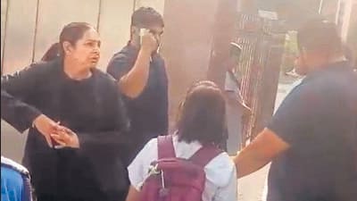 Bouncers at the school’s gate seen checking IDs of students. Bouncers at the school’s gate seen checking IDs of students.
