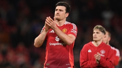 Manchester United's English defender #05 Harry Maguire applauds fans on the pitch after the UEFA Europa league quarter-final final (AFP) Manchester United's English defender #05 Harry Maguire applauds fans on the pitch after the UEFA Europa league quarter-final final (AFP)