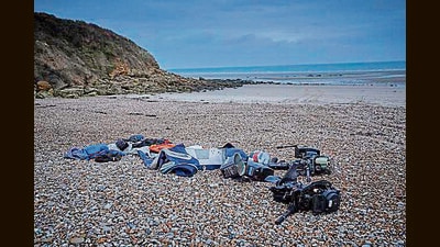 Migrants’ belongings on the beach of Wimereux, on November 25, 2021, in Calais, France. At least 31 people died trying to cross the Channel to the UK in an inflatable dinghy. The Small Boat is based on this incident. (Kiran Ridley/Getty Images)