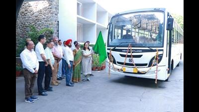 PU V-C Renu Vig flagging off the new 45-seater buses on Friday. A tractor for tree pruning was also introduced. (HT Photo)