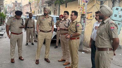 Police officials during a search operation as part of the drive in the city on Friday. (HT Photo)