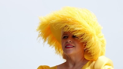 A woman dons a bold, furry, bright yellow hat as she enjoys the festivities of Black-Eyed Susan Day, leading up to the 150th Preakness Stakes at Pimlico Race Course. Emilee Chinn/Getty Images/AFP (Photo by Emilee Chinn / GETTY IMAGES NORTH AMERICA / Getty Images via AFP) (Getty Images via AFP) A woman dons a bold, furry, bright yellow hat as she enjoys the festivities of Black-Eyed Susan Day, leading up to the 150th Preakness Stakes at Pimlico Race Course. Emilee Chinn/Getty Images/AFP (Photo by Emilee Chinn / GETTY IMAGES NORTH AMERICA / Getty Images via AFP) (Getty Images via AFP)
