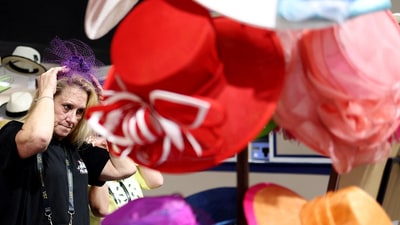 A woman picks out the perfect hat, adding a touch of style to her Black-Eyed Susan Day look at the 150th Preakness Stakes 2025.Emilee Chinn/Getty Images/AFP (Photo by Emilee Chinn / GETTY IMAGES NORTH AMERICA / Getty Images via AFP) (Getty Images via AFP) A woman picks out the perfect hat, adding a touch of style to her Black-Eyed Susan Day look at the 150th Preakness Stakes 2025.Emilee Chinn/Getty Images/AFP (Photo by Emilee Chinn / GETTY IMAGES NORTH AMERICA / Getty Images via AFP) (Getty Images via AFP)