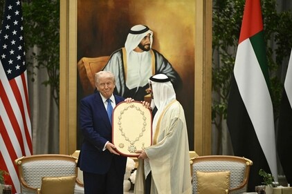 US President Donald Trump (L)receives the Order of Zayed, United Arab Emirates' highest civil decoration named after the first president of the UAE, Zayed bin Sultan Al Nahyan, from his UAE counterpart Sheikh Mohamed bin Zayed Al Nahyan, at Qasr Al-Watan (Palace of the Nation) in Abu Dhabi on May 15, 2025. The United Arab Emirates is the third leg of Trump's visit to the region, which has already taken him to Saudi Arabia and Qatar. (Photo by Brendan SMIALOWSKI / AFP) (AFP) US President Donald Trump (L)receives the Order of Zayed, United Arab Emirates' highest civil decoration named after the first president of the UAE, Zayed bin Sultan Al Nahyan, from his UAE counterpart Sheikh Mohamed bin Zayed Al Nahyan, at Qasr Al-Watan (Palace of the Nation) in Abu Dhabi on May 15, 2025. The United Arab Emirates is the third leg of Trump's visit to the region, which has already taken him to Saudi Arabia and Qatar. (Photo by Brendan SMIALOWSKI / AFP) (AFP)
