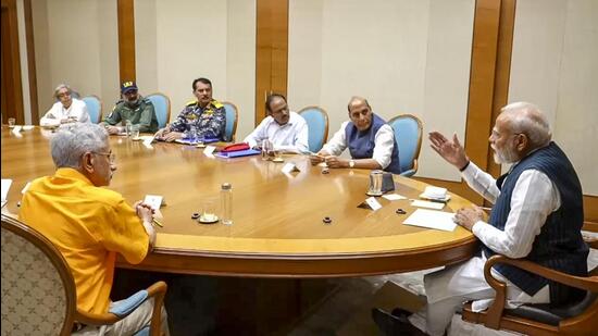 Prime Minister Narendra Modi interacts with defence minister Rajnath Singh, external affairs minister S Jaishankar (left), National Security Advisor Ajit Doval and the tri-services chiefs. (PMO)