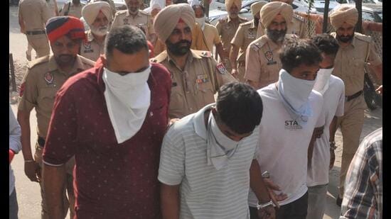 Punjab Police producing accused of Majitha hooch tragedy in the district court in Amritsar on Friday. (Sameer Sehgal/Hindustan Times)