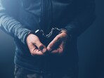 Arrested computer hacker and cyber criminal with handcuffs, close up of hands. (iStockphoto) Arrested computer hacker and cyber criminal with handcuffs, close up of hands. (iStockphoto)