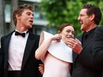 Cast members Emma Stone, Pedro Pascal, and Austin Butler avoid a bee during the screening of the film Eddington, in competition at the 78th Cannes Film Festival in Cannes.
