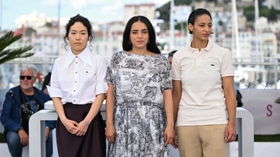 South korean singer and dancer Park Ji-Min, French actress Hafsia Herzi and French actress Nadia Melliti pose during a photocall for the film "La Petite derniere" (The Little Sister) at the 78th edition of the Cannes Film Festival in Cannes, southern France, on May 17, 2025. (Photo by Bertrand GUAY / AFP) (AFP) South korean singer and dancer Park Ji-Min, French actress Hafsia Herzi and French actress Nadia Melliti pose during a photocall for the film "La Petite derniere" (The Little Sister) at the 78th edition of the Cannes Film Festival in Cannes, southern France, on May 17, 2025. (Photo by Bertrand GUAY / AFP) (AFP)