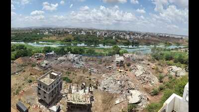 Flood lines are demarcated by the irrigation department based on flood risk assessments, and any construction activity within these zones is prohibited. (MAHENDRA KOLHE/ HT)