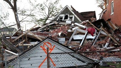 A house lies completely collapsed under a mountain of bricks, after a tornado struck in St. Louis, Missouri. (REUTERS)