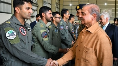 Pakistan's Prime Minister Shehbaz Sharif greets pilots during a visit to Pakistan Air Force's base at Kamra. (AFP) Pakistan's Prime Minister Shehbaz Sharif greets pilots during a visit to Pakistan Air Force's base at Kamra. (AFP)
